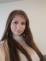 A person with long brown hair

Description automatically generated
